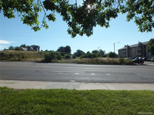 a view of street with a cars parked on road