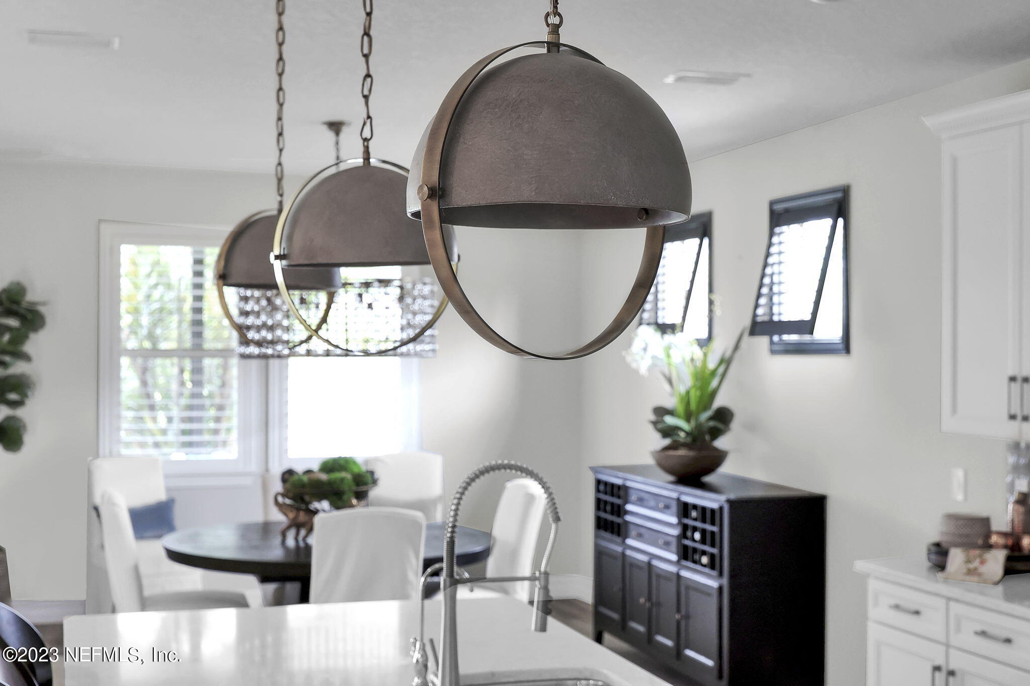 100 Tree Side Lane Ponte Vedra, FL 32081 - Photo 11 of 118 a dining room with furniture a potted plant and a chandelier