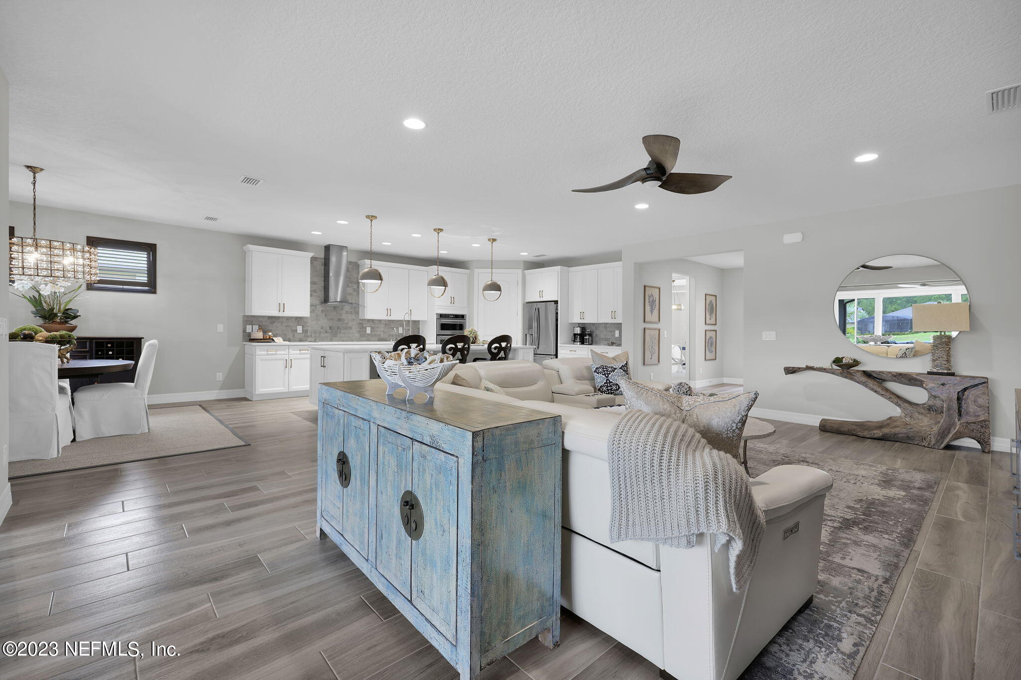 100 Tree Side Lane Ponte Vedra, FL 32081 - Photo 19 of 118 a large kitchen with stainless steel appliances kitchen island granite countertop a lot of cabinets and wooden floor