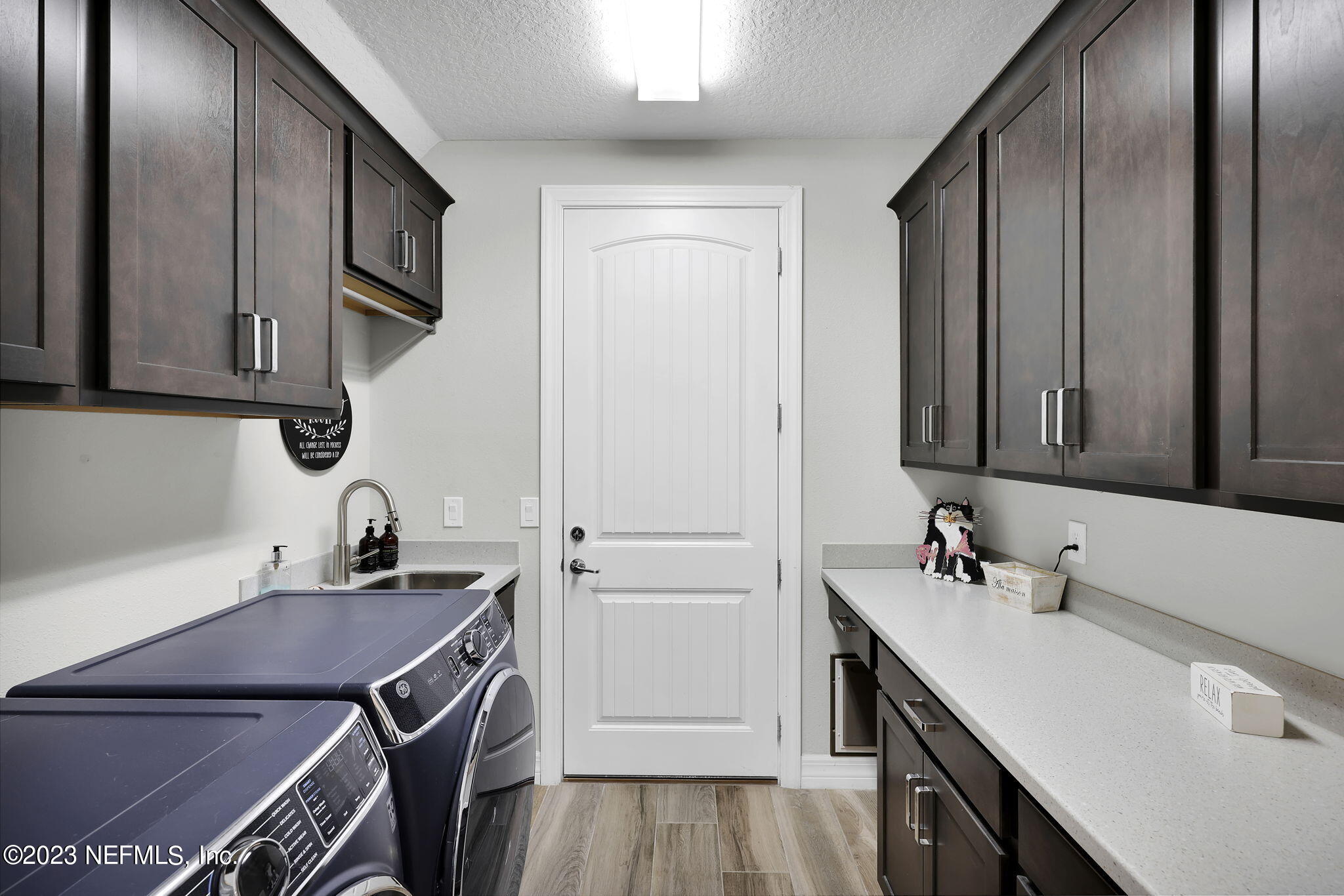 100 Tree Side Lane Ponte Vedra, FL 32081 - Photo 32 of 118 a kitchen with a sink cabinets and stainless steel appliances