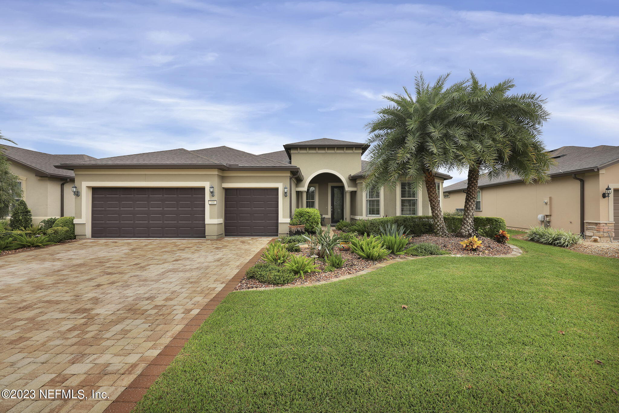 100 Tree Side Lane Ponte Vedra, FL 32081 - Photo 6 of 118 a front view of a house with garden and trees