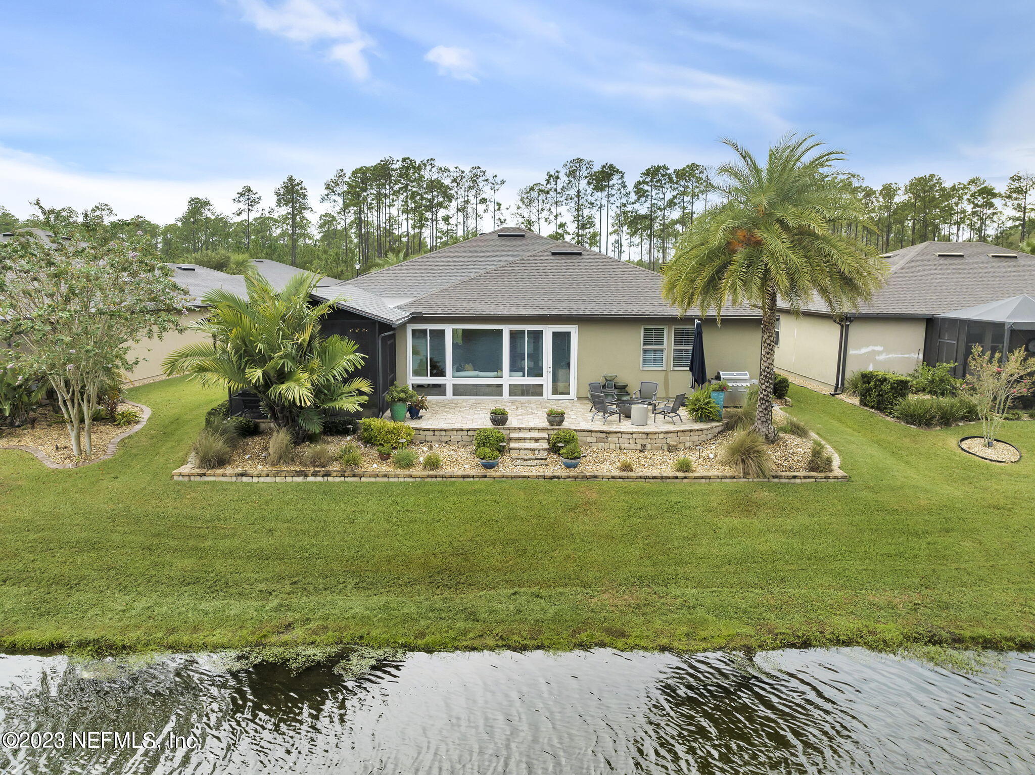 100 Tree Side Lane Ponte Vedra, FL 32081 - Photo 69 of 118 a front view of a house with garden
