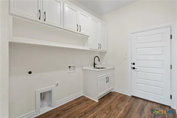 a view of cabinets with wooden floor