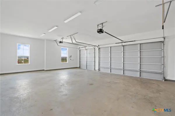 a view of a porch with furniture and garden