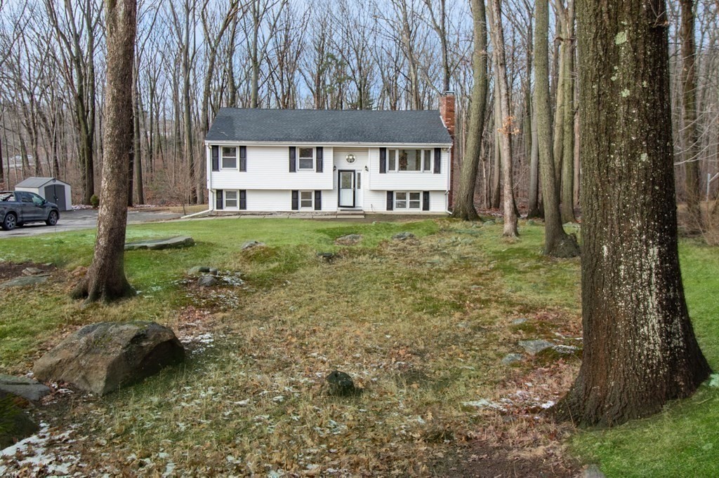 3 Colonial Road Sutton, MA 01590 - Photo 23 of 26 a view of a house with a yard