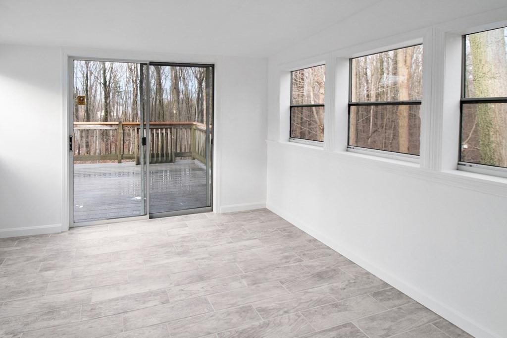 3 Colonial Road Sutton, MA 01590 - Photo 5 of 26 an empty room with windows