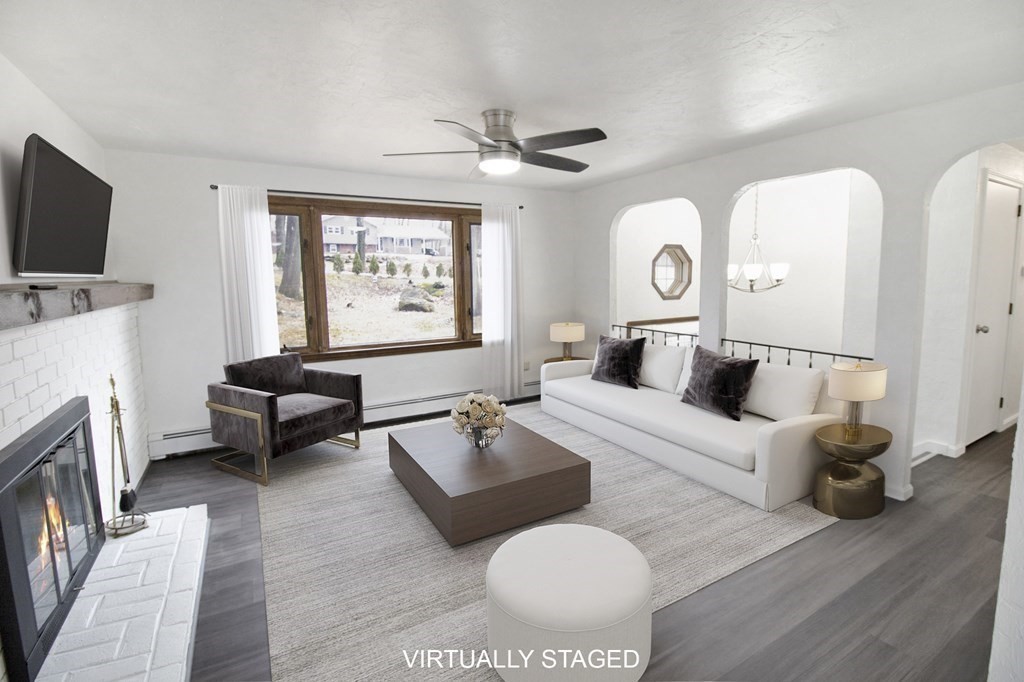 3 Colonial Road Sutton, MA 01590 - Photo 7 of 26 a living room with furniture and a flat screen tv