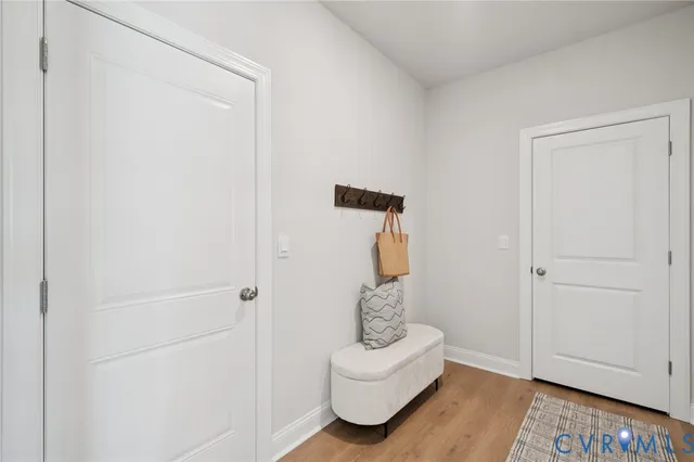a utility room with cabinets washer and dryer