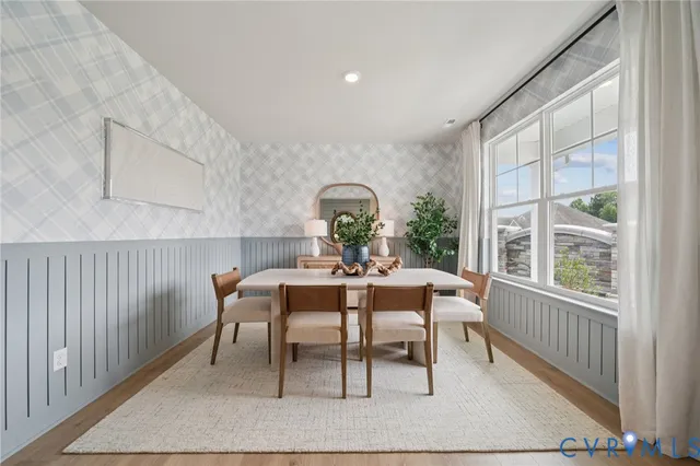 a dining room with furniture and window