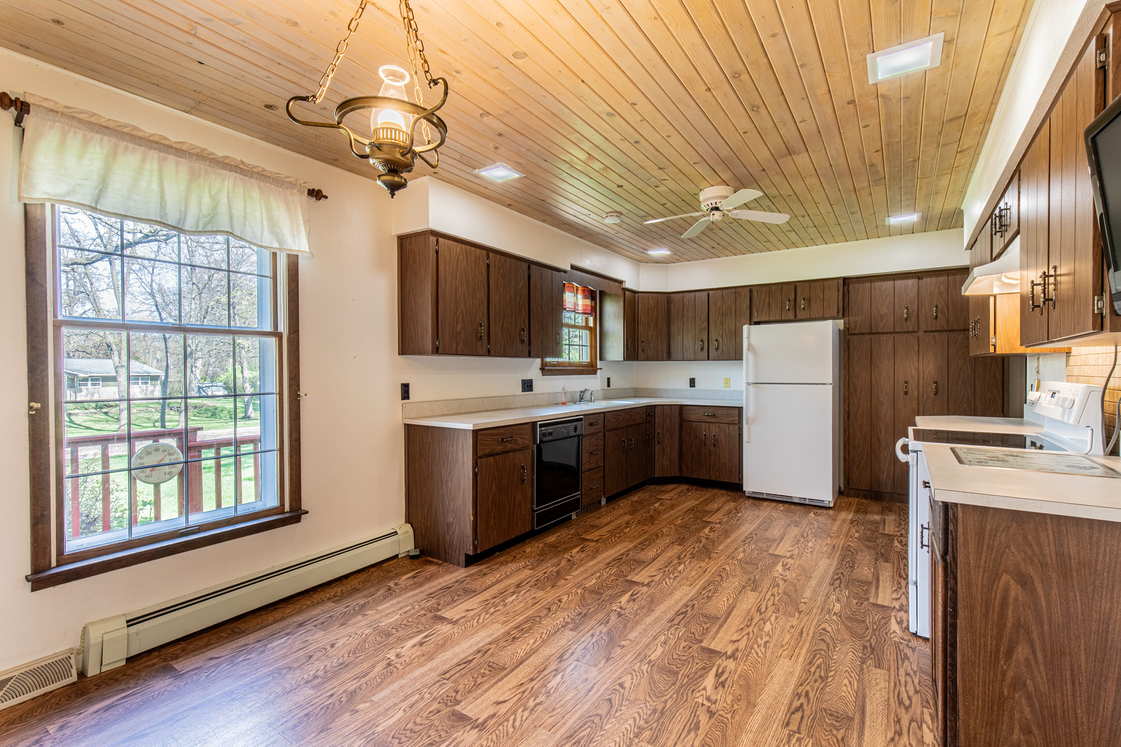 1 Century Road Spring Valley, IL 61362 - Photo 8 of 24 a large kitchen with a large window a sink stainless steel appliances and cabinets