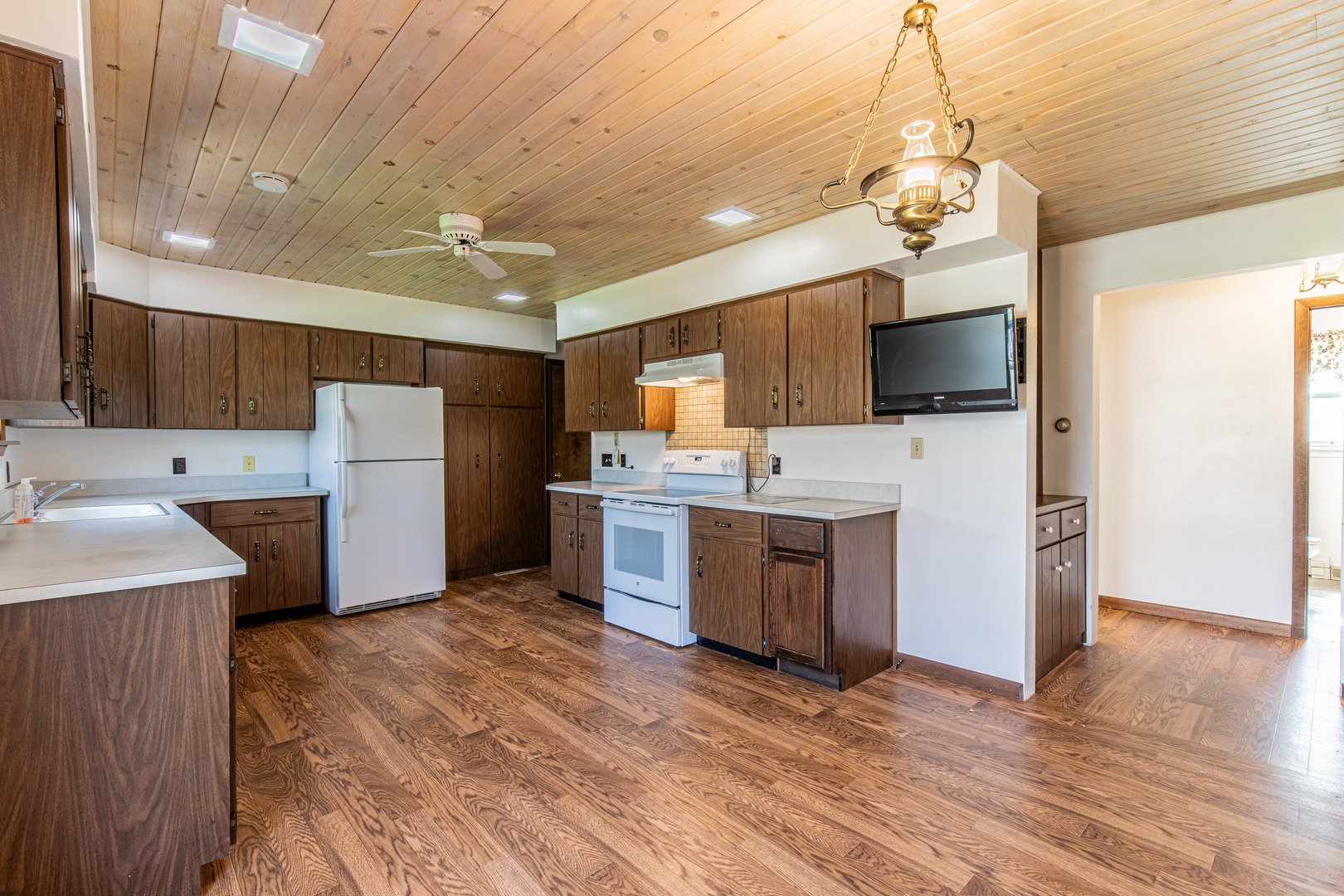 1 Century Road Spring Valley, IL 61362 - Photo 9 of 24 a kitchen with a refrigerator sink and wooden floor