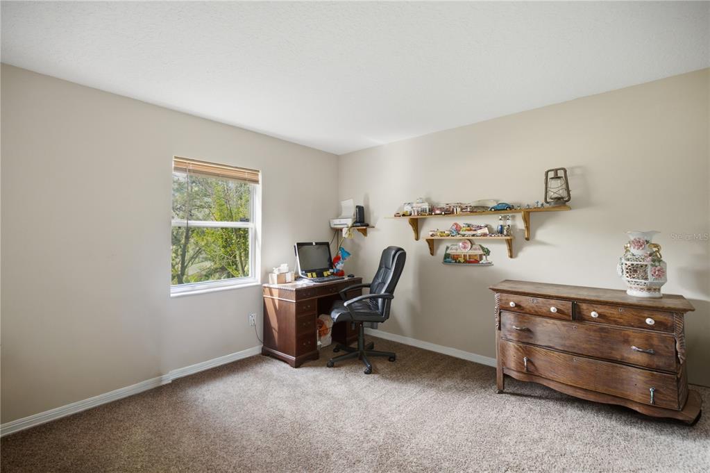 17900 Northwest 120th Avenue Road Reddick, FL 32686 - Photo 37 of 45 a view of workspace with furniture and a window