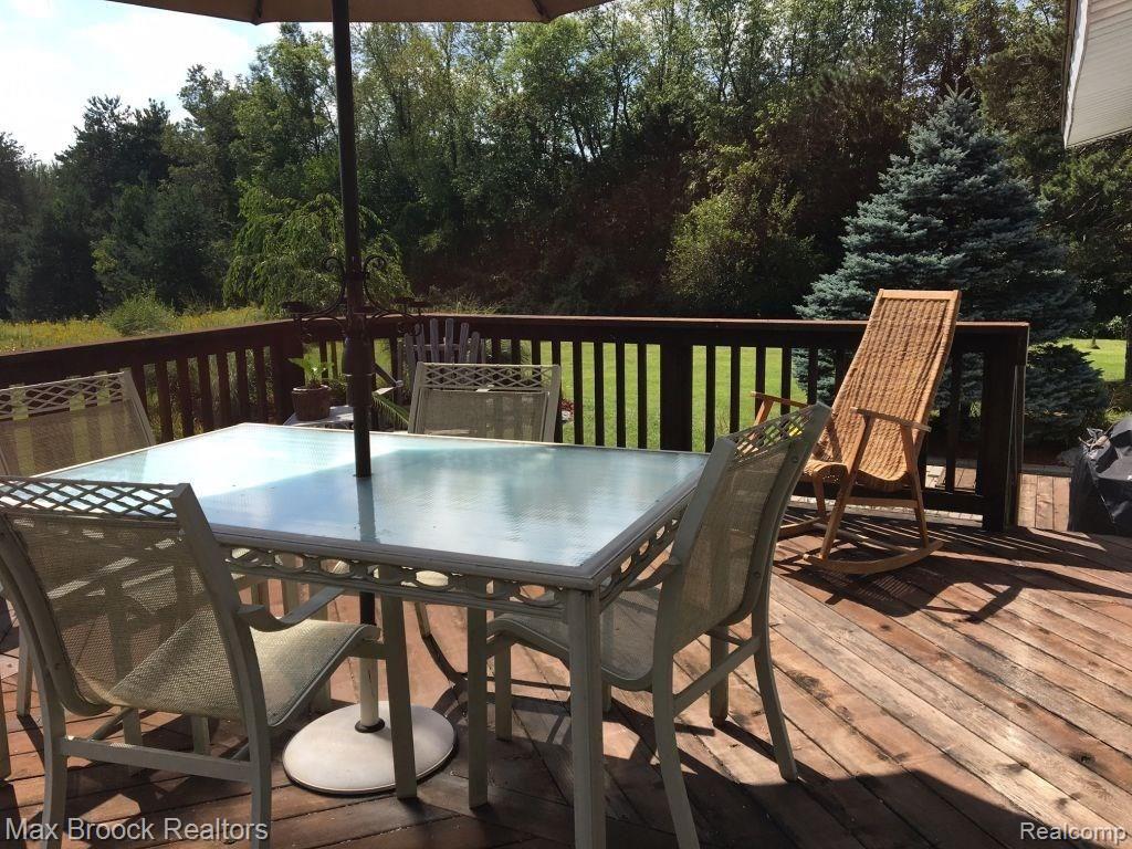 9895 Rattalee Lake Road Clarkston, MI 48348 - Photo 23 of 34 Cedar deck at the back of the home..look how private it is! Located right off the living/dining rooms.