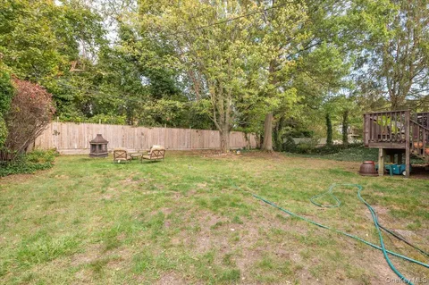 a view of a yard with large trees
