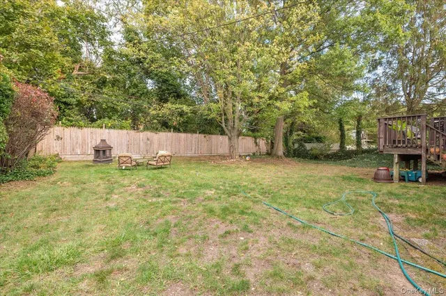 a view of a yard with large trees