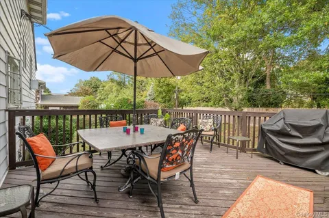 an outdoor space with furniture and umbrella
