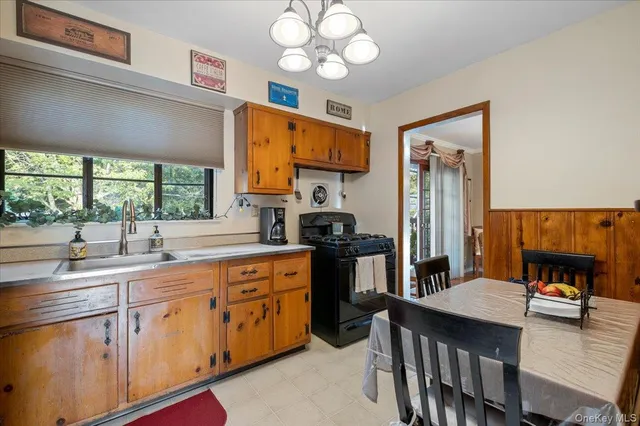 a kitchen with a sink cabinets and window