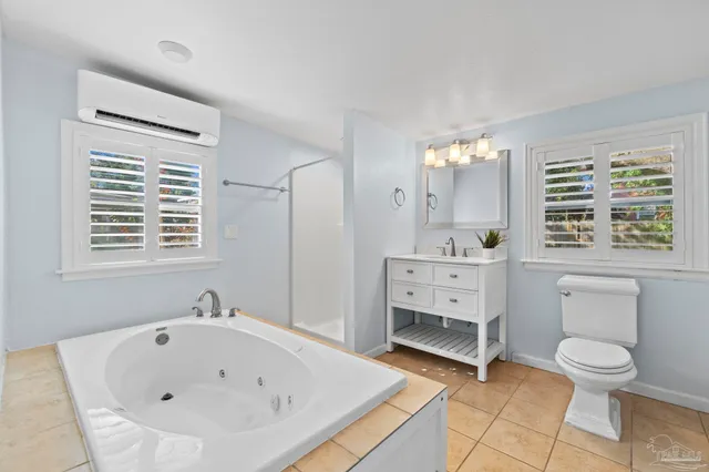 a bathroom with a sink a toilet and bathtub