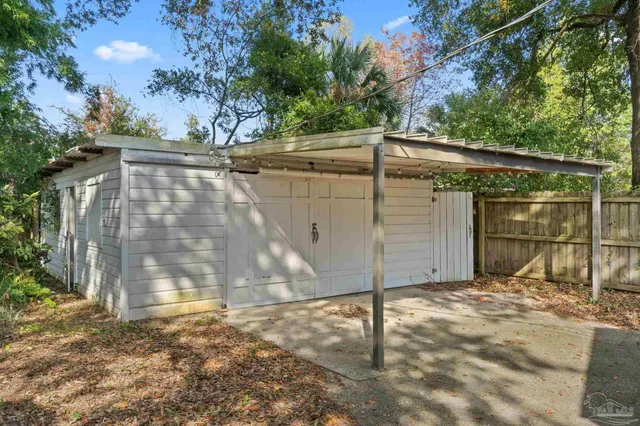 a backyard of a house with a tree