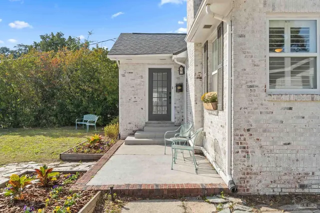 a view of a house with a small yard
