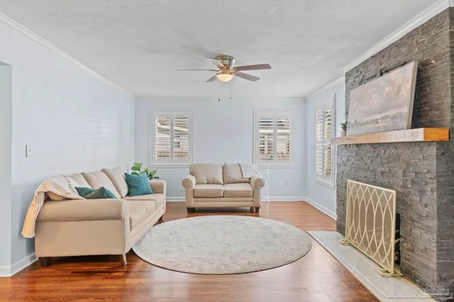 a living room with furniture and a fireplace