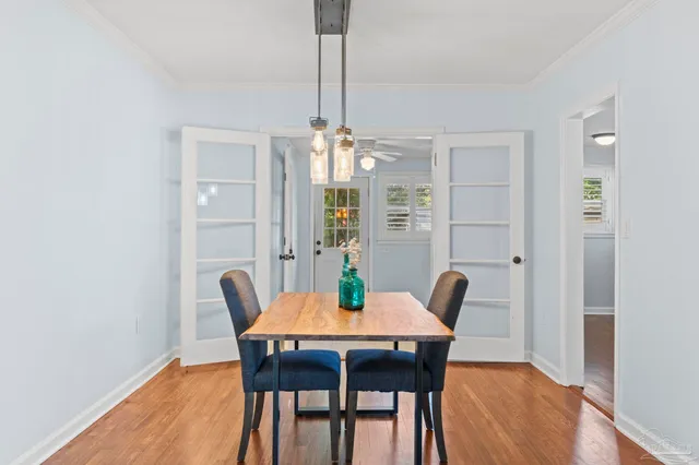 a view of a dining room with furniture window and wooden floor