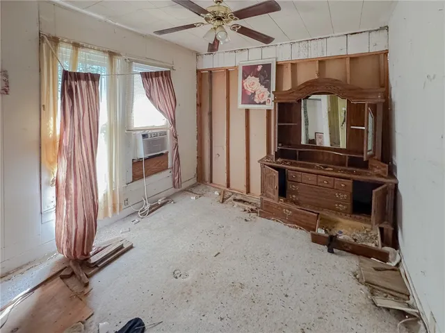 a view of a livingroom with furniture and windows