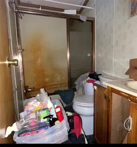 a view of a kitchen and sink refrigerator