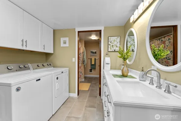 a bathroom with a sink and a mirror