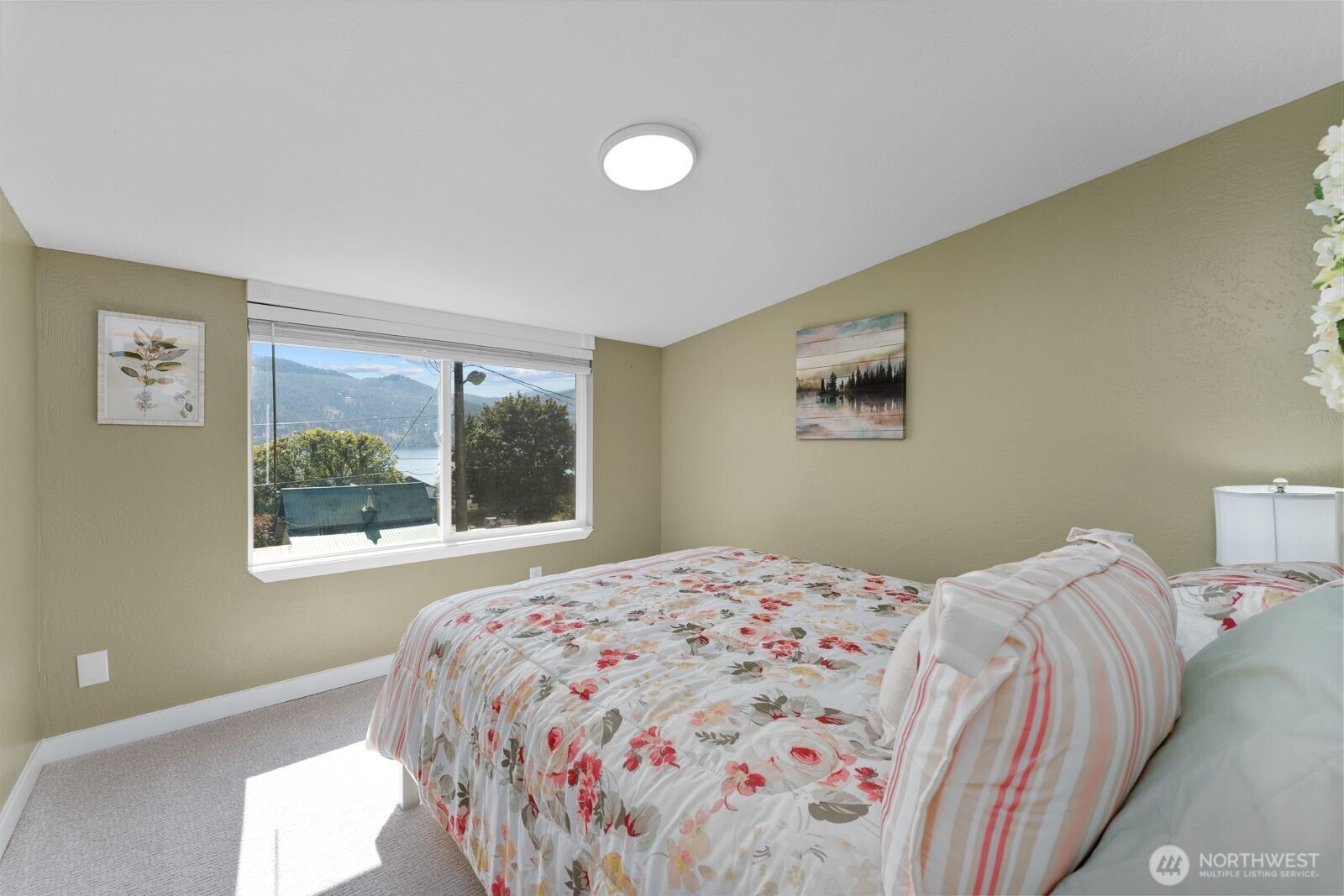 703 Boetzke Avenue Manson, WA 98831 - Photo 12 of 40 a bedroom with a bed and a window