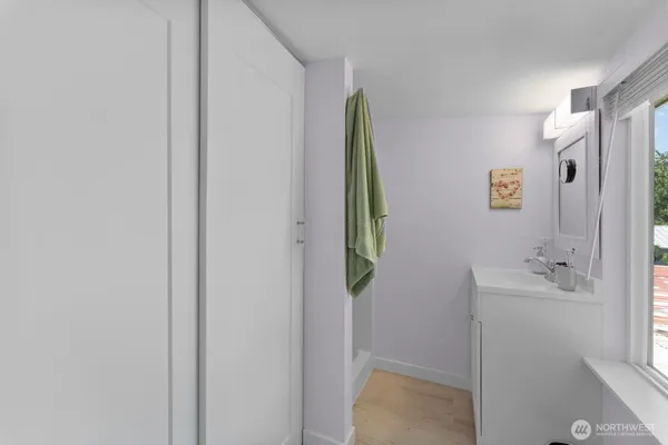 a bathroom with a bathtub and a shower