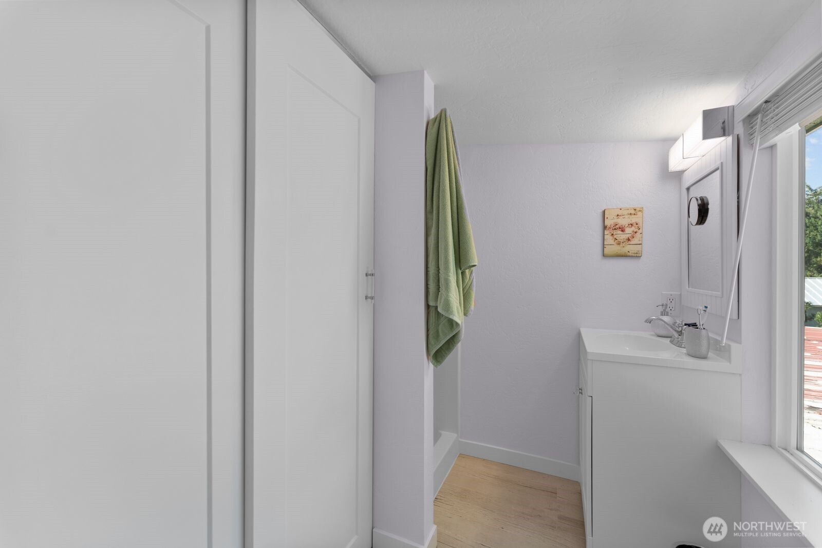 703 Boetzke Avenue Manson, WA 98831 - Photo 13 of 40 a bathroom with a bathtub and a shower