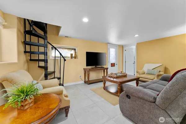 a living room with furniture and a flat screen tv