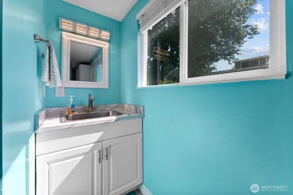 a bathroom with a sink and a mirror