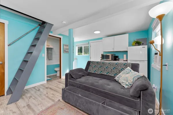 a living room with furniture and a rug