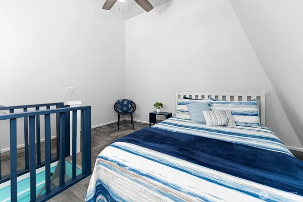 a bedroom with a bed and cabinets