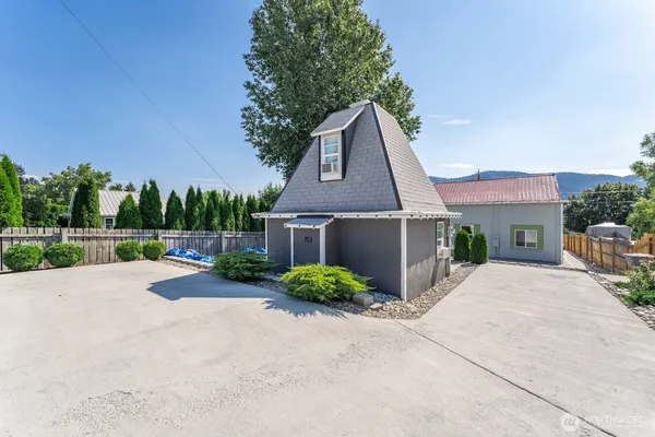 a front view of a house with yard and a garage