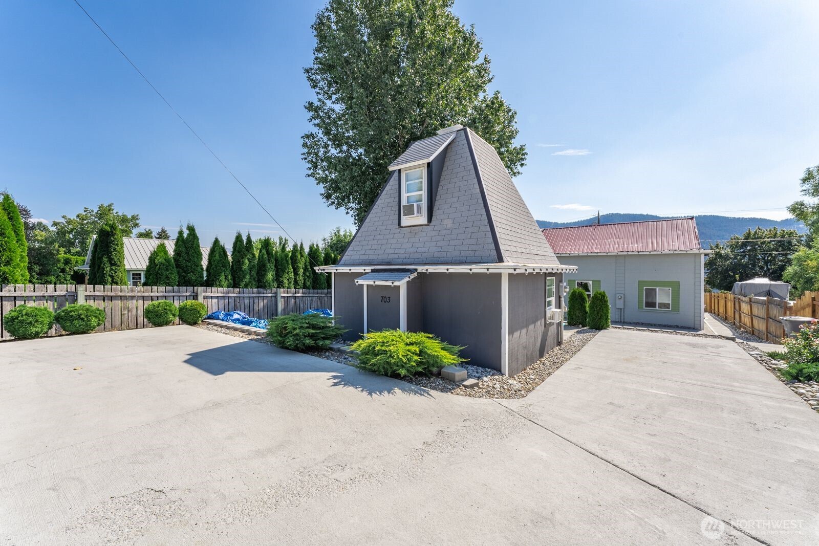 703 Boetzke Avenue Manson, WA 98831 - Photo 39 of 40 a front view of a house with yard and a garage