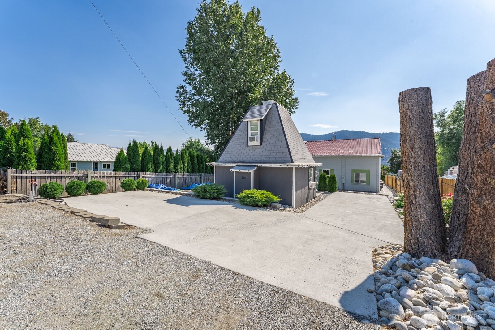 703 Boetzke Avenue Manson, WA 98831 - Photo 40 of 40 a front view of a house with a yard and garage