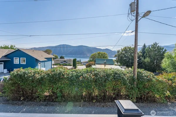 a view of a house with a yard and plants