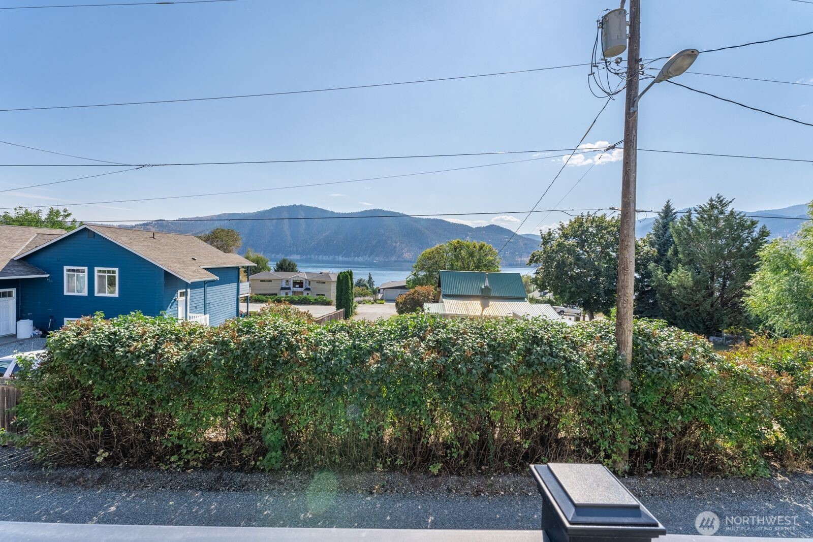 703 Boetzke Avenue Manson, WA 98831 - Photo 4 of 40 a view of a house with a yard and plants