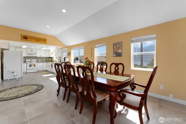 a dining room with furniture and window