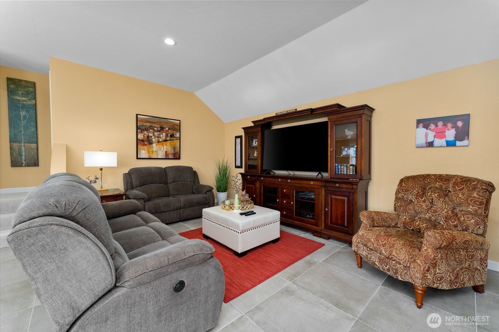 703 Boetzke Avenue Manson, WA 98831 - Photo 9 of 40 a living room with furniture and a flat screen tv