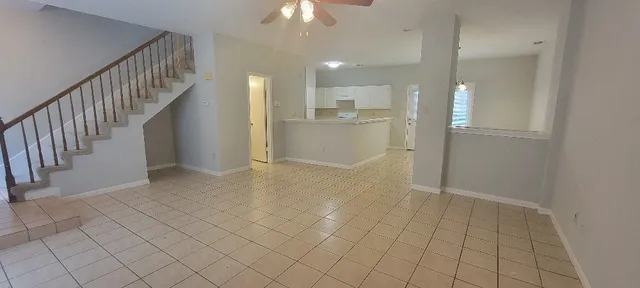 a view of entryway with kitchen and chandelier