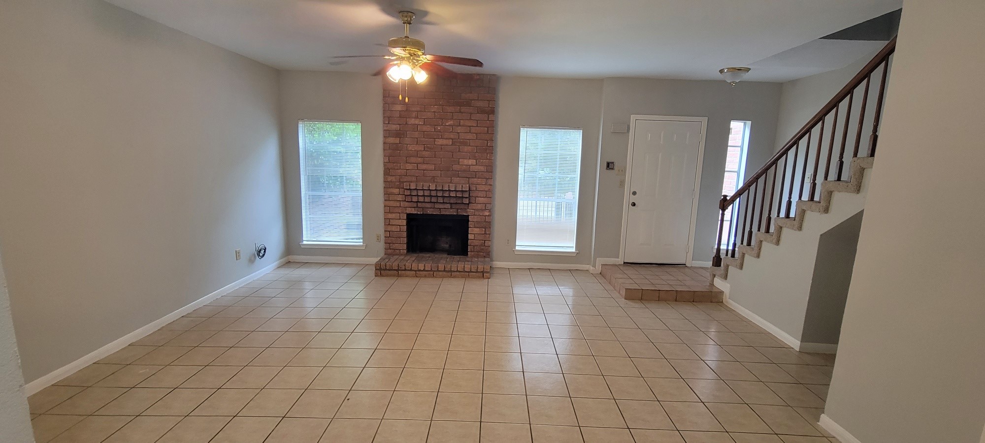 7023 Alabonson Road Houston, TX 77088 - Photo 3 of 13 a view of entryway and hall with a fireplace
