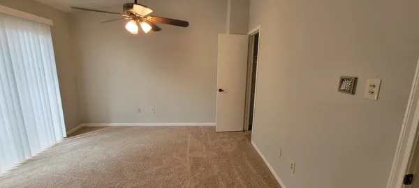 a view of an empty room with a window