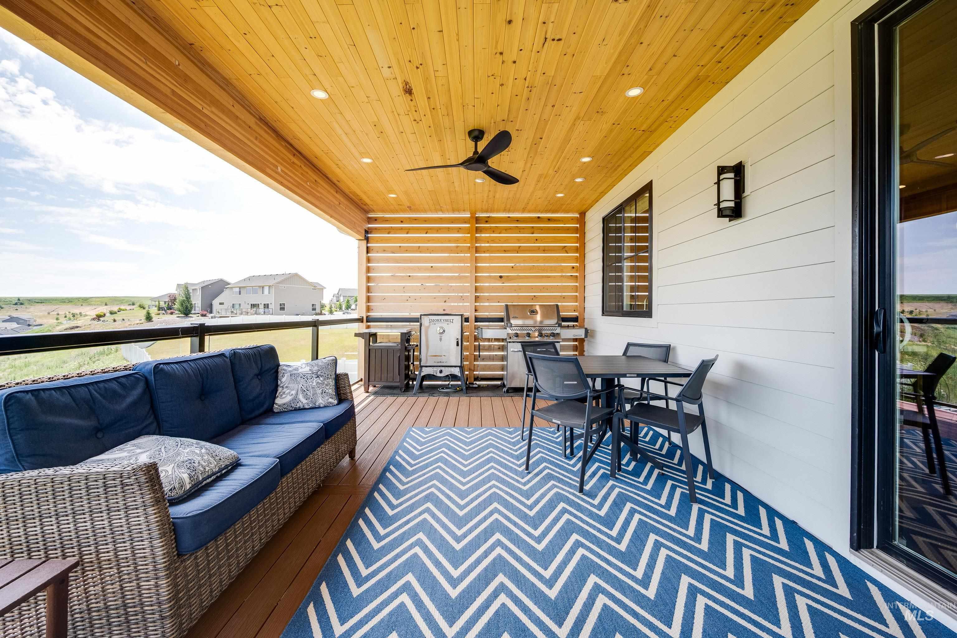 1325 Southwest Panorama Drive Pullman, WA 99163 - Photo 17 of 48 View of patio / terrace featuring outdoor dining space, a ceiling fan, grilling area, an outdoor hangout area, and a wooden deck
