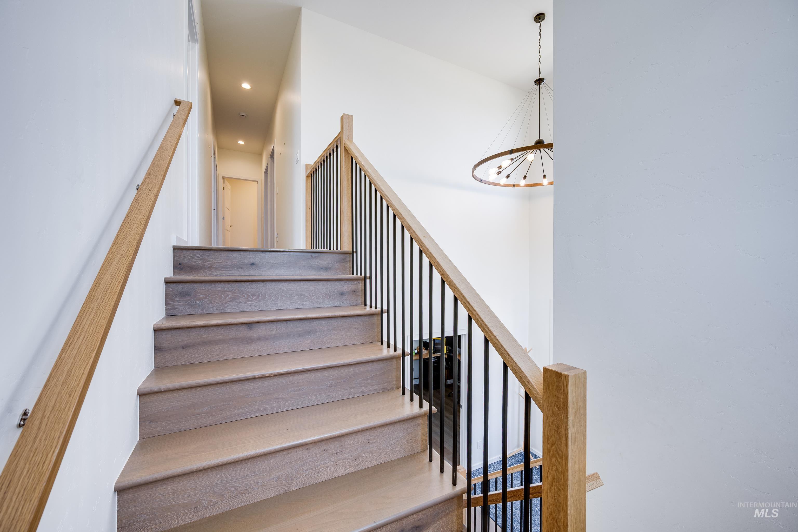 1325 Southwest Panorama Drive Pullman, WA 99163 - Photo 18 of 48 Stairway featuring recessed lighting and a chandelier