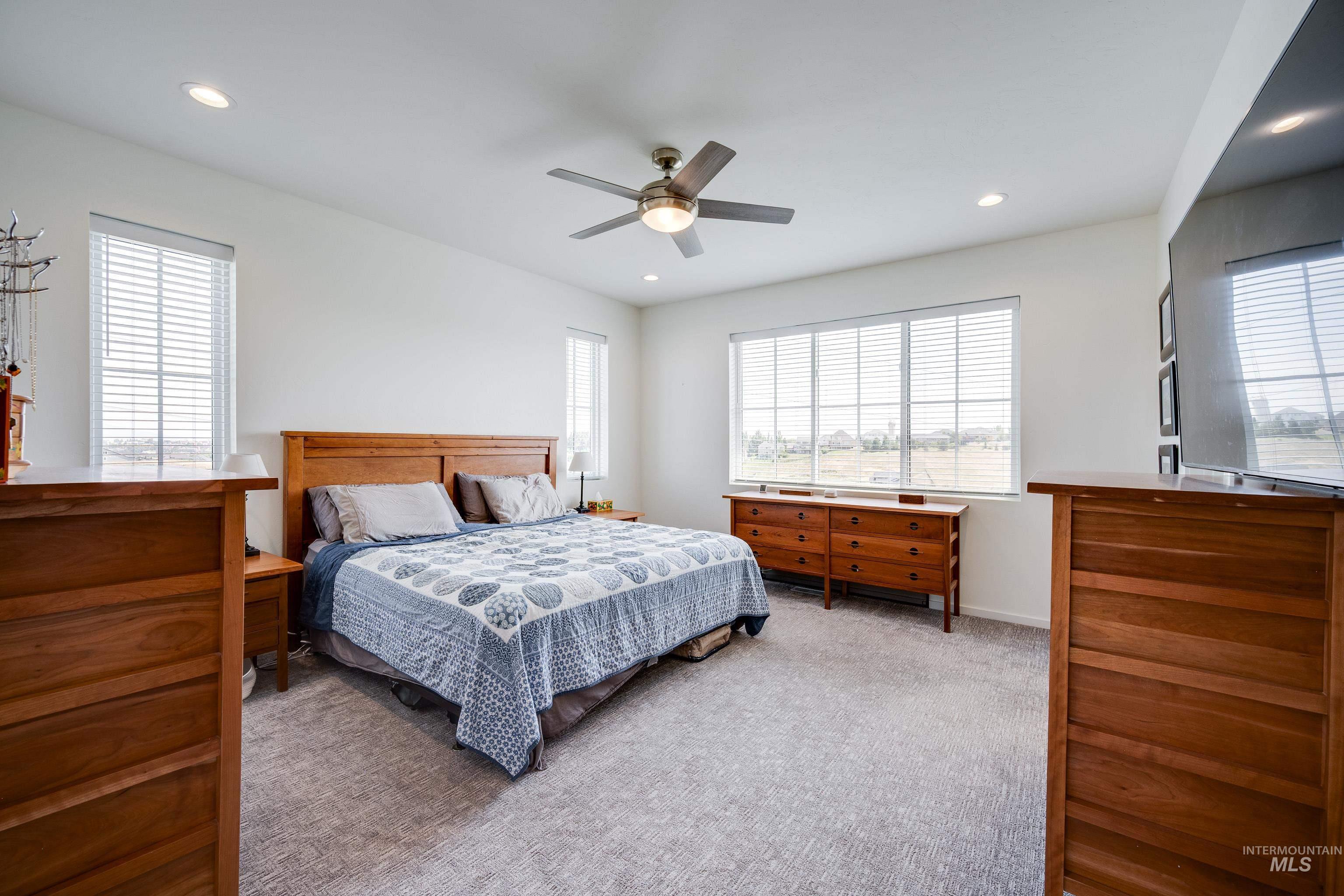 1325 Southwest Panorama Drive Pullman, WA 99163 - Photo 19 of 48 Bedroom with light colored carpet, recessed lighting, and ceiling fan