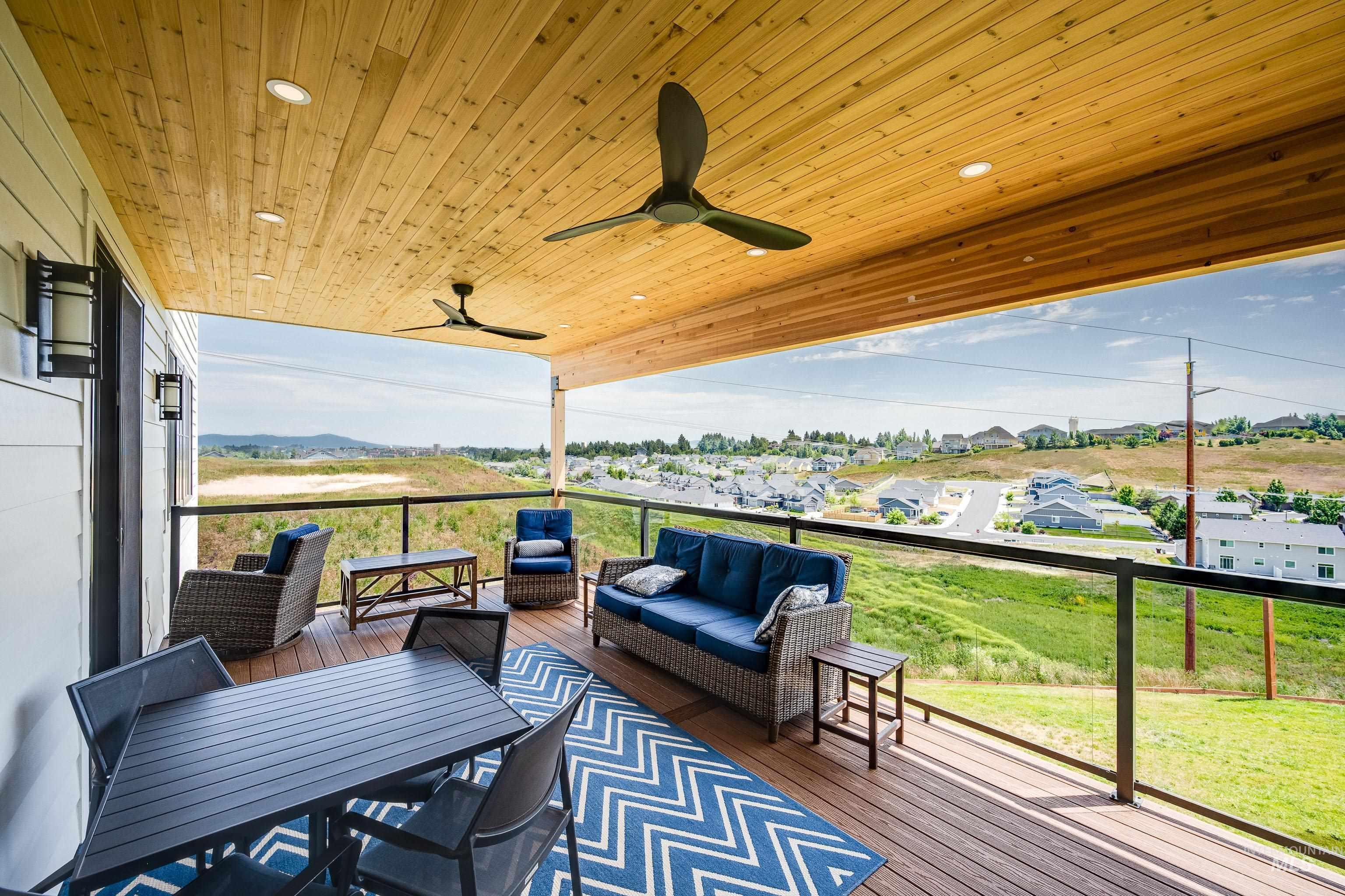 1325 Southwest Panorama Drive Pullman, WA 99163 - Photo 2 of 48 Wooden deck featuring a residential view, outdoor lounge area, and a ceiling fan